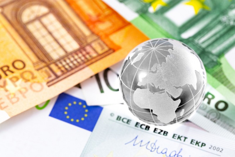 business finance concept in sphere globe and money, closeup euro banknotes